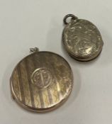 A small gold locket together with a gilt example.