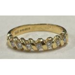 A good 18 carat gold and diamond seven stone half eternity ring.