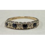 A sapphire and diamond half eternity ring in 9 carat.