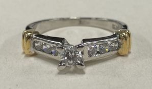 An 18 carat gold diamond mounted seven stone ring.