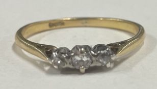 A small diamond three stone ring in 18 carat gold setting.