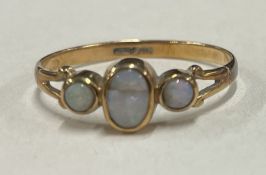 An opal three stone ring in 9 carat.