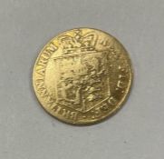 An 1818 George III half Sovereign. Est. £240 - £28