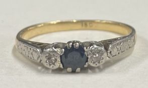 A small sapphire and diamond three stone ring in 18 carat and platinum.
