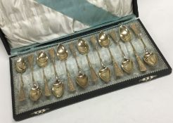 A fine set of twelve French silver gilt teaspoons contained within a fitted box.