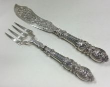 A pair of large Victorian Aesthetic Movement silver servers. Birmingham 1850. By George Unite.