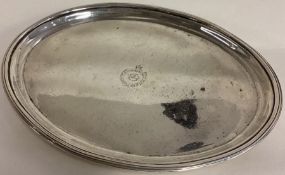 PETER & ANN BATEMAN: A George III silver teapot stand with moon crest to centre. London 1804.