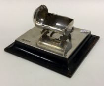 A novelty Edwardian silver stamp holder in the form of a cradle. London 1904. By Mappin & Webb.