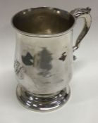 An 18th Century George III silver half pint mug. London 1785. Incuse mark. By George Smith.