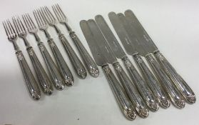 A fine set of twelve Victorian silver dessert knives and forks with bead work decoration. Sheffield.