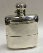 A large silver flask with detachable cup. Birmingham 1916. By Mappin & Webb.