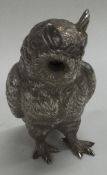 A heavy cast silver figure of an owl. London 1973.