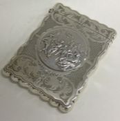 An Edwardian silver card case embossed with tavern scene. Birmingham 1908. By William Hayes.