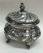 A Victorian silver chased tea caddy bearing import marks. London 1888. By Edward Thompson Bryant.