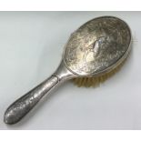 A Victorian chased silver brush embossed with birds. Birmingham 1900. By Elkington & Co.