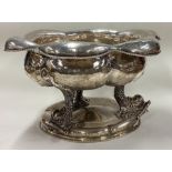 A good English import marked silver bowl cast with dolphins.