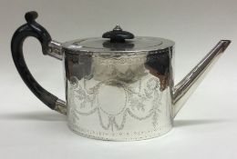 An 18th Century George III bright-cut silver teapot. London 1777.
