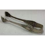 A pair of French silver claw ice tongs.