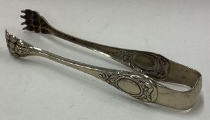 A pair of French silver claw ice tongs.