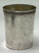 A heavy Russian silver beaker with engraved decoration. Marked to base.