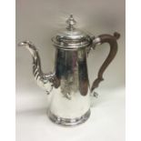 An 18th Century Georgian silver coffee pot bearing coat of arms. London 1764. By John Swift.