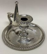 PAUL STORR: A fine quality silver chamber stick with fluted border together with matching snuffer.