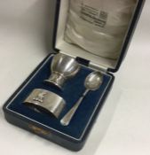 A silver three piece christening set. London 1938. By Goldsmiths and Silversmiths.