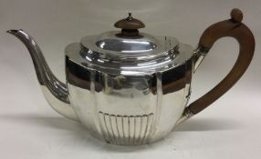 A George III fluted silver flat bottom teapot. London 1804. By Robert & Samuel Hennell.