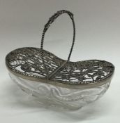 A silver and glass double basket with pierced and flroal decoration. London 1908. By William Comyns.
