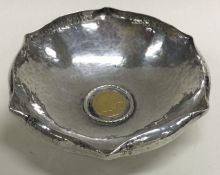 RAMSDEN & CARR: A silver bowl with gold coin to centre. London 1911.