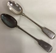 A pair of large crested fiddle pattern plated basting spoons.