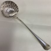 A large George III bottom marked fluted silver soup ladle. London 1764. By Thomas & William Chawner.