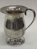 A silver christening mug. Birmingham 1977. By B&Co.