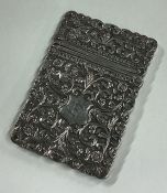 A chased 19th Century silver card case. Marked to interior.
