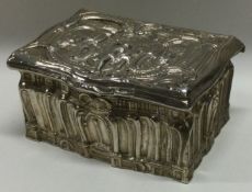 A Continental silver chased 19th Century hinged box decorated with tavern scene.