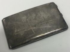 An engraved Persian silver cigarette case decorated with a river and temples.