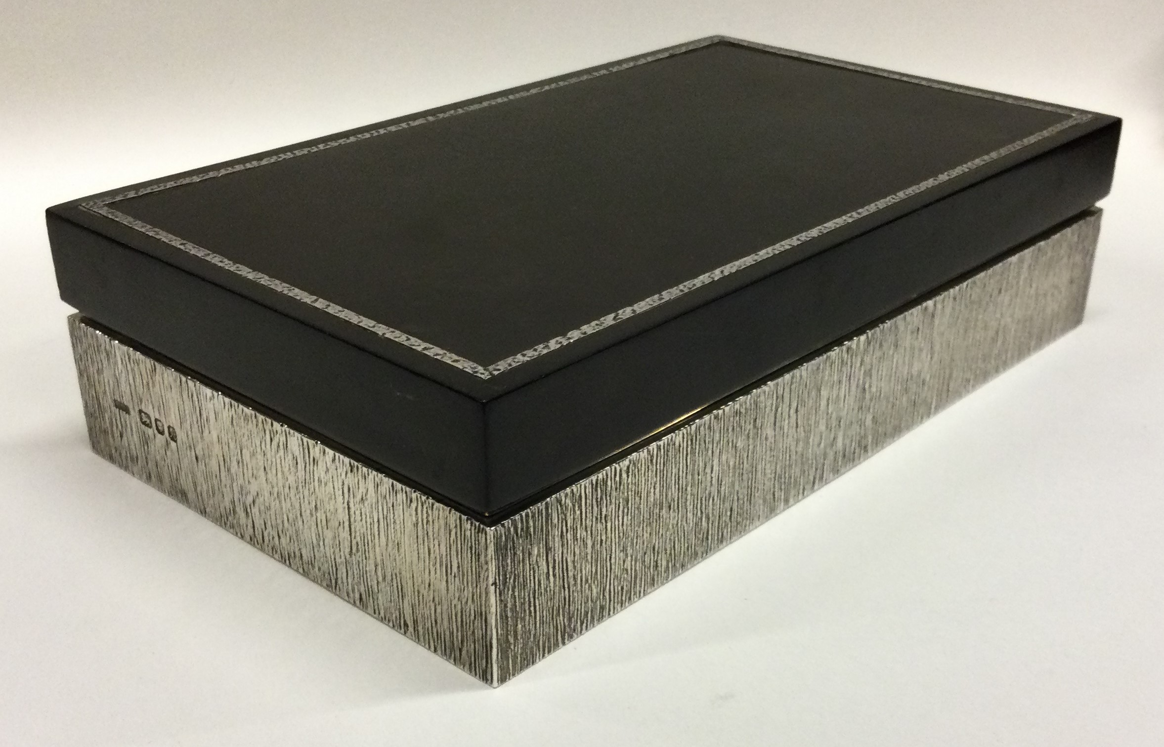 A heavy silver cigar box with bark finish. London 1975. By House of Lawrian. - Image 2 of 2