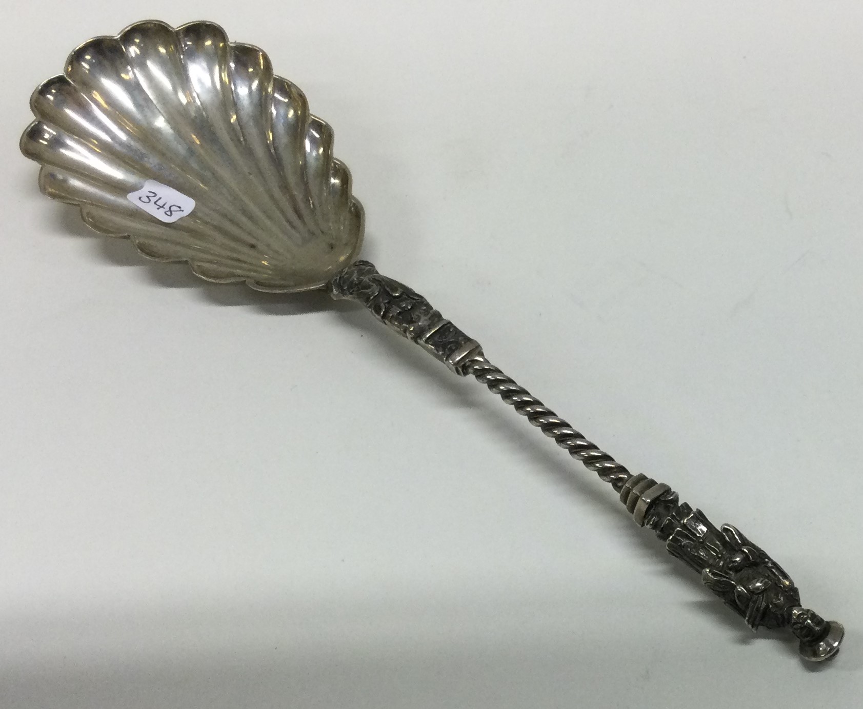 WANG HING: A 19th Century Chinese export silver spoon with Emperor decoration.