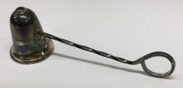 A silver candle snuffer. London 2000. By Wakely & Wheeler.