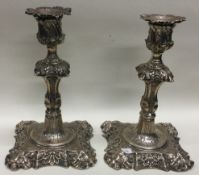 A pair of George II cast silver candlesticks. London 1753. By John Cafe.
