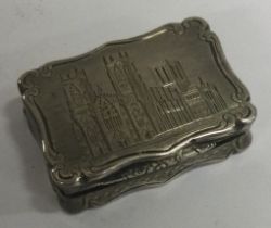 A Victorian silver castle top engraved vinaigrette depicting York Minster.