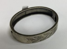 A silver engraved bangle. Birmingham.