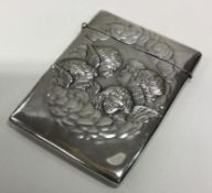 A silver card case embossed with cherubs. Birmingham 1904.