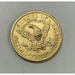 A USA Liberty head five dollar coin.