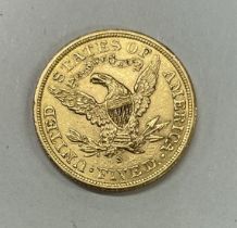 A USA Liberty head five dollar coin.