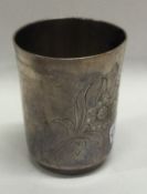 An early 19th Century Russian silver vodka tot with engraved decoration.