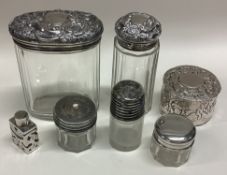 A quantity of silver mounted dressing table jars.