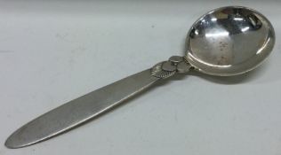 GEORG JENSEN: A silver sauce ladle of typical stylised design.
