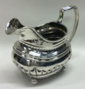 A good Georgian silver cream jug. London. By IB.