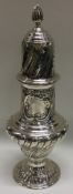 A fluted Victorian silver sugar caster. London 1899. By Goldsmiths & Silversmiths.